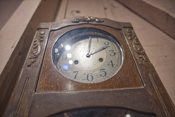 istock Antique wall clock in a wooden case 2232672859