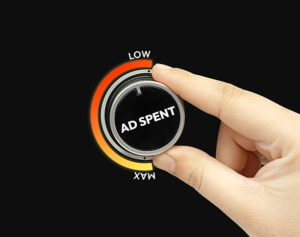 istock A hand turning knob showing minimum ad spent on marketing and business concept, backdrop. Strategy, promotion 2232674013
