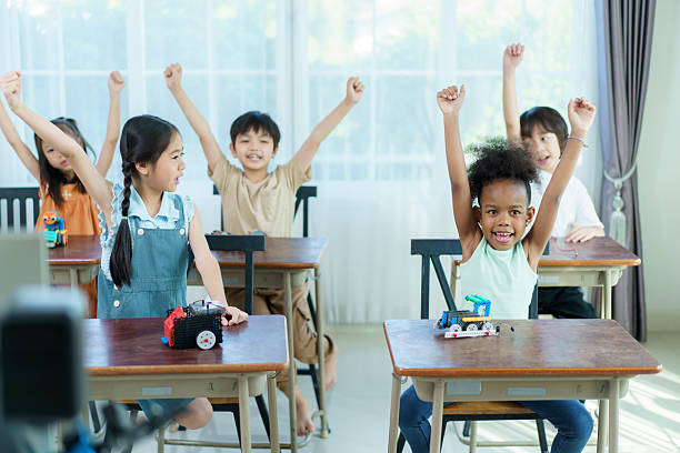 A group of diverse ethnicity children are enjoy learning in STEM classroom. STEM stand for science, technology, engineering, and mathematics is help to develop learning skills and talents in children.