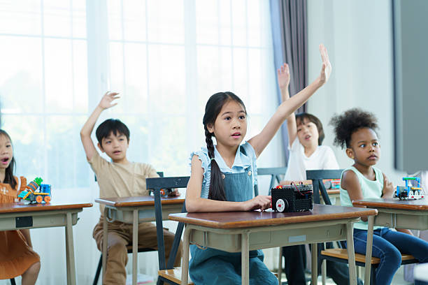 A group of diverse ethnicity children are enjoy learning in STEM classroom. STEM stand for science, technology, engineering, and mathematics is help to develop learning skills and talents in children.