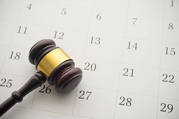 istock Judge wood gavel hammer on white blank calendar background copy space. 2232679975
