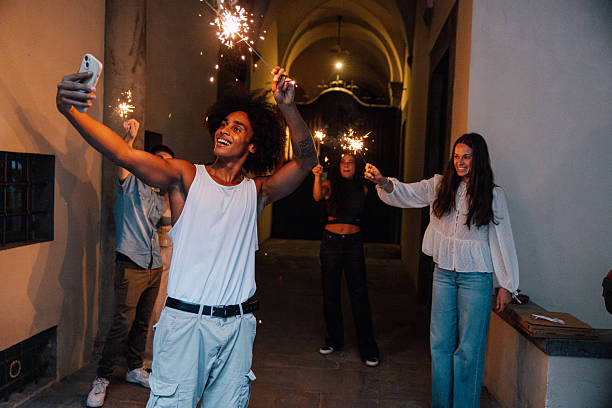 istock A bright smile and glowing sparklers set the perfect mood for celebration 2232682570