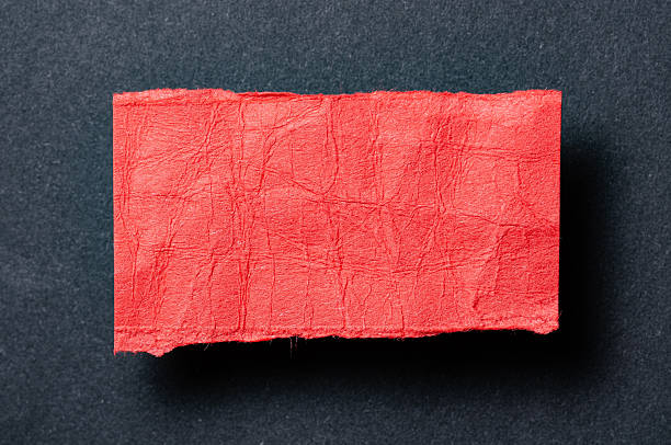 istock One single red torn ripped wrinkled crumpled blank paper note with shadow and copy space for text on black background 2232683126