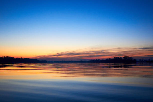 Sunset over the river during the cold season