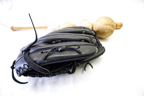 Baseball gloves, balls, and bats