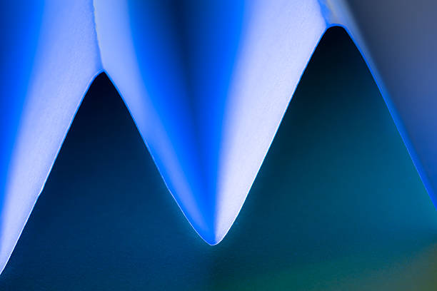 istock Abstract composition of paper curves illuminated by soft blue light 2232691190