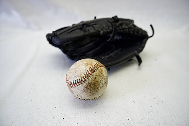 Baseball gloves, balls, and bats