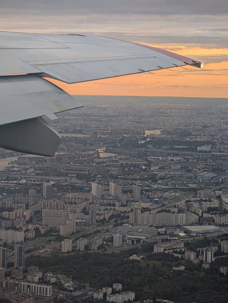 istock Scenic View from Airplane Wing at Sunset Over Urban Landscape 2232694111