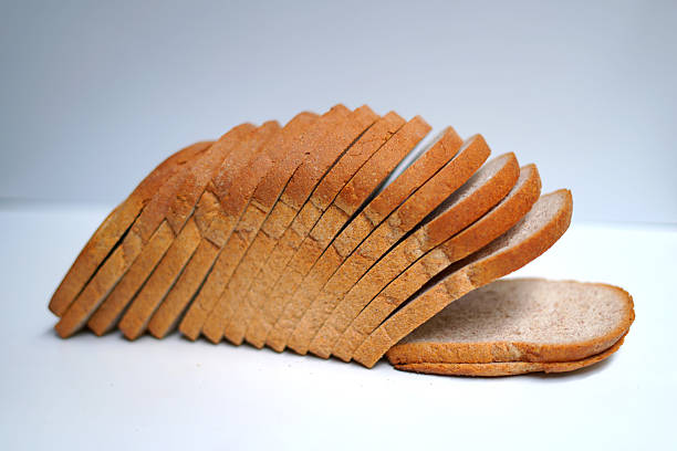 istock load of bread sliced on white table 2232694930