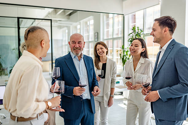 istock Team celebrates success with a toast and wine in a modern office environment 2232698908