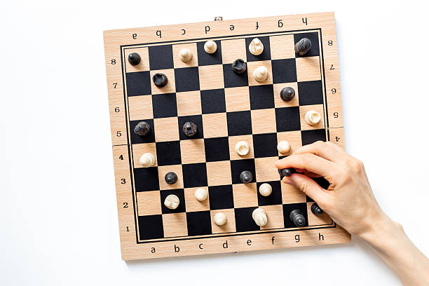 istock Hand is holding chess piece on chessboard. Game concept 2232699615