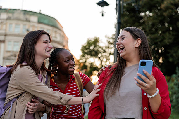 istock Friends Using a Mobile Phone in the City 2232701803