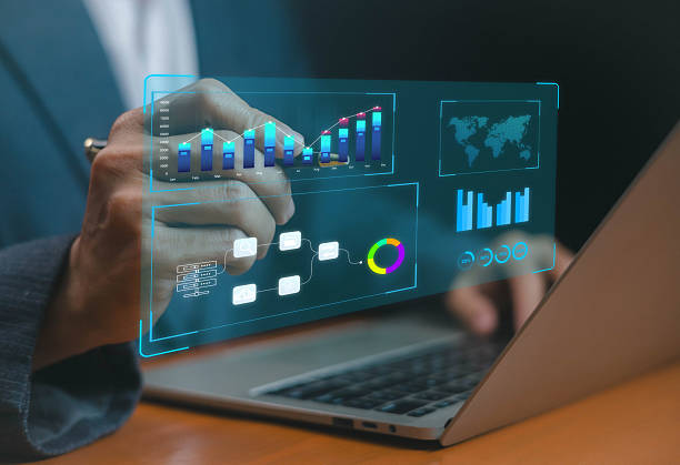istock Businessman analyzing digital data visualization with futuristic charts and graphs on laptop screen, concept of big data, financial analytics, business intelligence, and technology. 2232702047