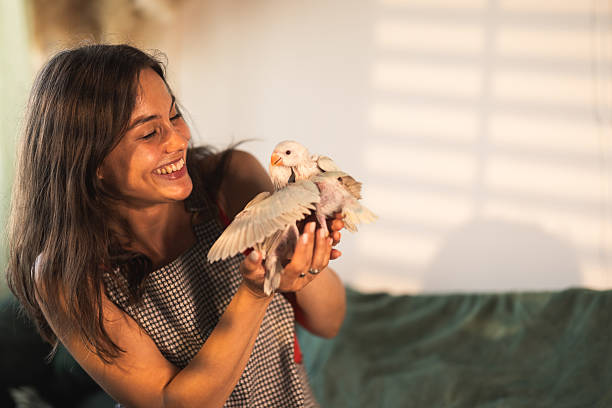 istock Happy Woman With Birds 2232706256