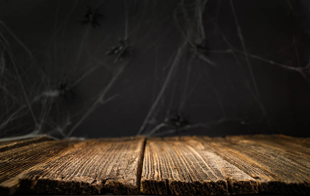 istock Halloween background. Old wooden table with dark background. Halloween table. Empty space. Place for product. 2232706652