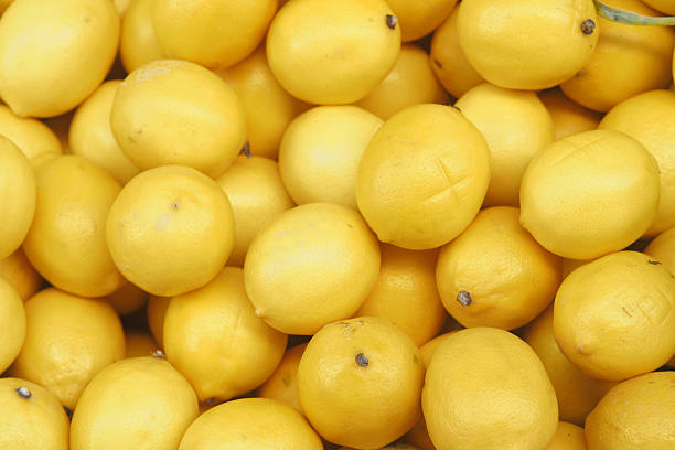 istock Freshly harvested lemons in a vibrant market display 2232707038
