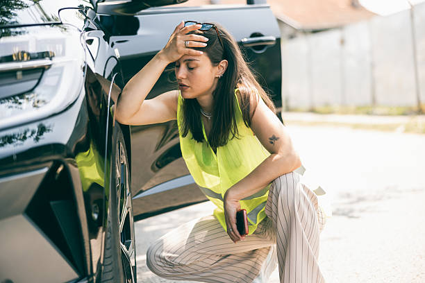 istock Woman Is Stressed Because Of Flat Tire 2232708852