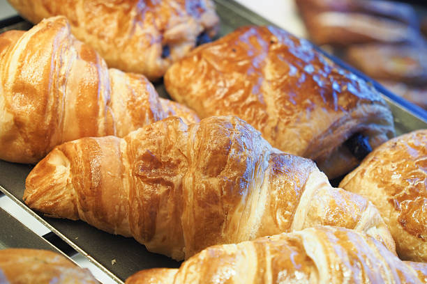 istock Freshly baked croissants displayed in a bakery's showcase 2232709532