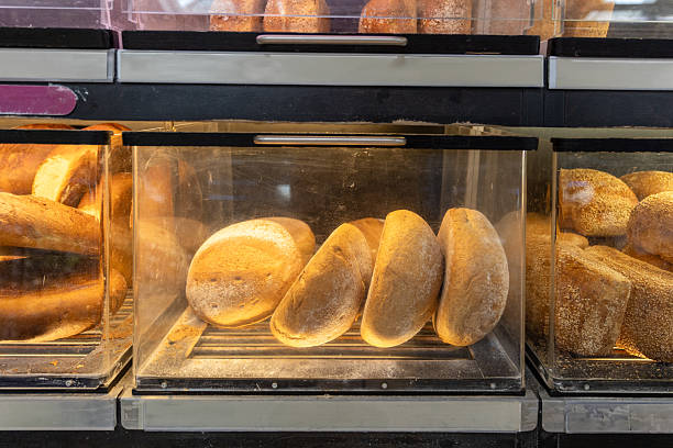 istock Round bread in boxes on the counter in the store. 2232711279