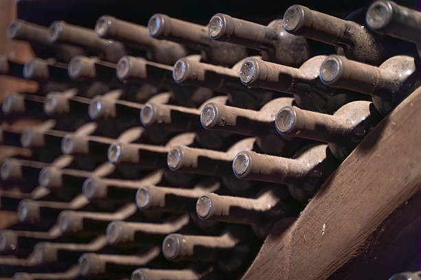 istock wine bottles in wine cellar warehouse background 2232712802