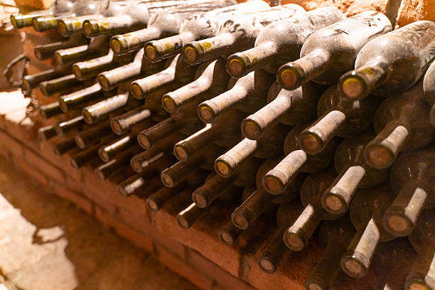 istock wine bottles in wine cellar warehouse background 2232712853