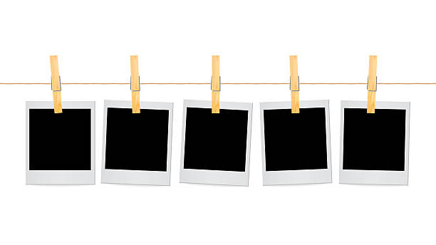 istock Realistic Polaroid Photo Frames Hanging on Rope with Wooden Clothespins – Blank Retro Instant Picture Template for Scrapbook, Memory Collage, Gallery Wall, and Photography Decoration 2232714560