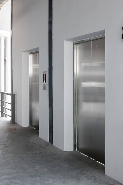 istock Elevator door and concrete floor in high rise building. 2232715511