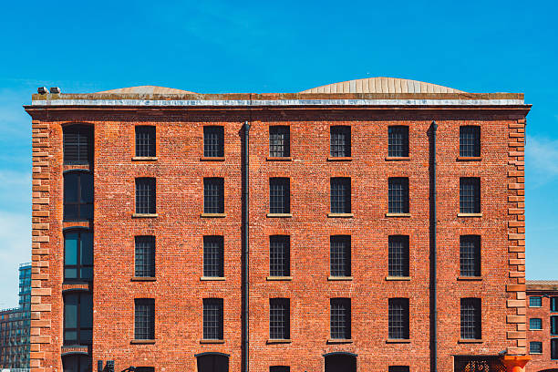 istock Albert dock building in liverpool showing red brick facade 2232715861