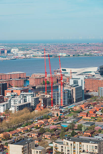 istock Construction cranes towering over liverpool's skyline on a sunny day 2232716005