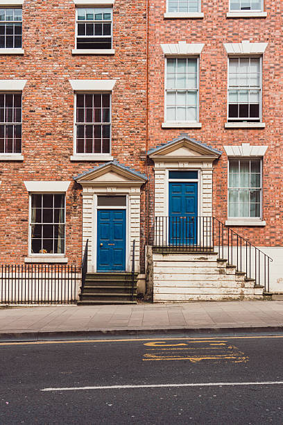 istock Two blue doors on a brick building in liverpool 2232716104