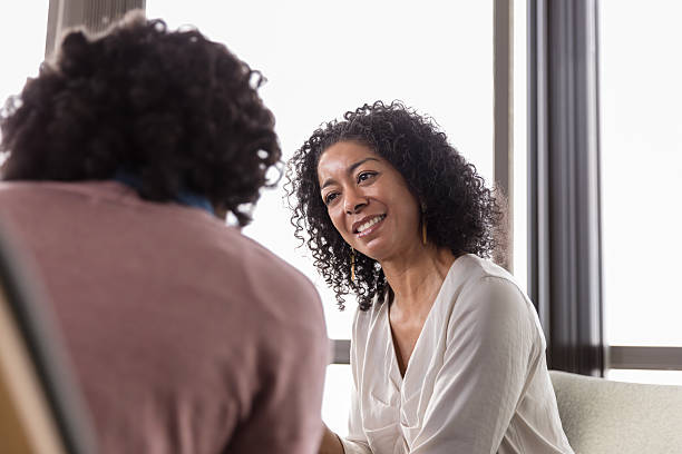 istock Smiling Woman Listening Attentively During Therapy Session 2232722298