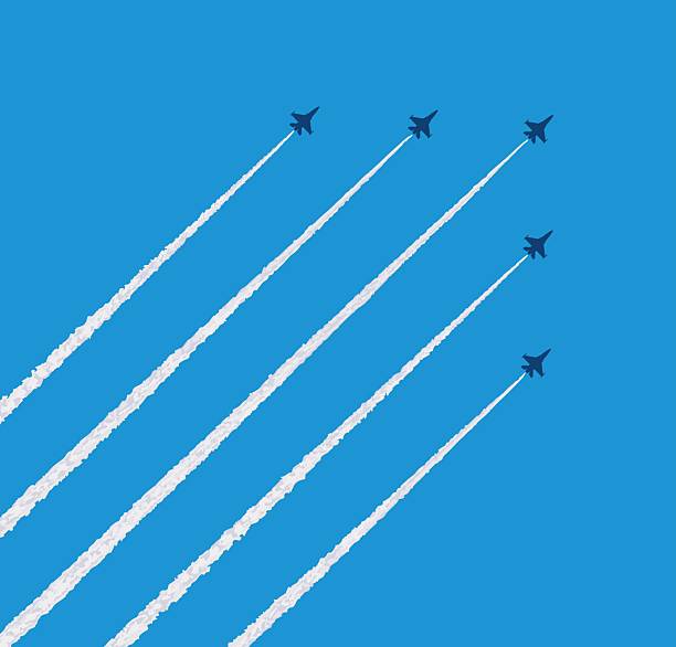 istock contrail and fighter jet silhouette,Fighter jets performing aerobatic flyovers at air shows and major events 2232727969