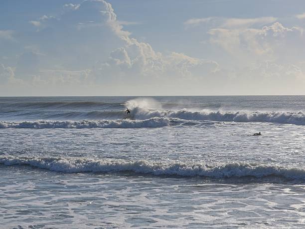 istock Large ocean swells provide excellent surfing at a Florida beach 2232733555