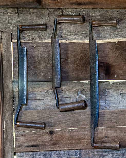 istock Old draw knives hanging in a work shed 2232735617