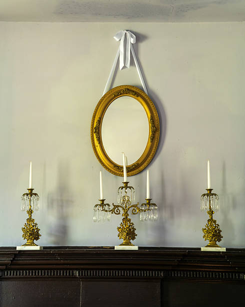 istock Antique bronze candlesticks sitting on a fireplace mantle 2232735722
