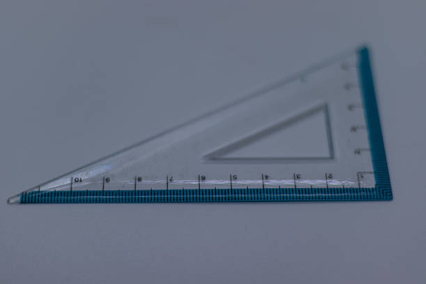 Pencil, eraser, and ruler on white background.