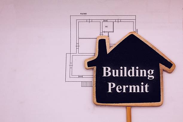 istock House model with the sign Building permit 2232736984