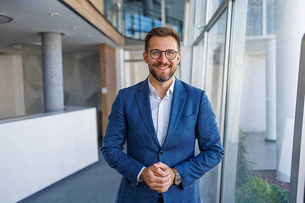 istock Confident businessman smiling in modern office 2232751776