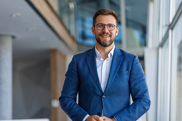 istock Confident businessman smiling in modern office 2232752049