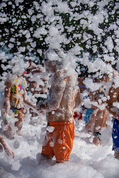 istock Middle-aged man dancing at a foam party 2232754618
