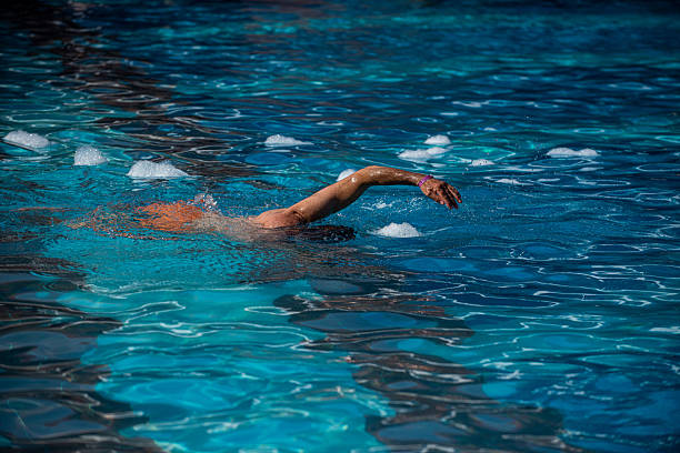 Dad doing a freestyle stroke in the pool