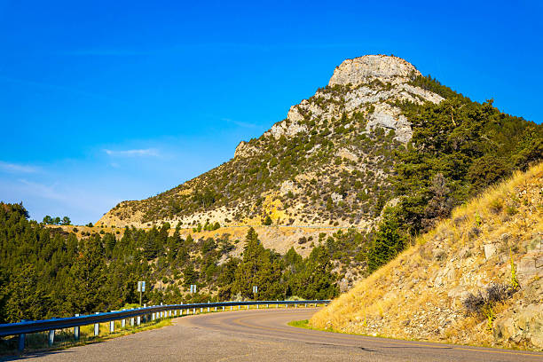 Hell's Gate Tunnel, Canada - April 2, 2023: Traffic heads south on the Trans-Canada Highway through Hell's Gate Tunnel by the Fraser River in the scenic Fraser Canyon. Spring morning with remaining snow on the tree area.