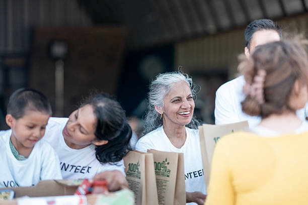 istock Group of Diverse Volunteers Working Together in a Community Outreach Program 2232762469