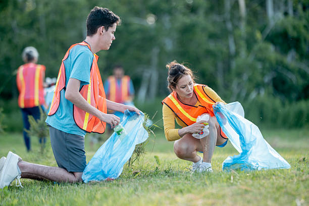 istock Volunteers Collecting Trash in a Park During a Community Cleanup Activity 2232762619