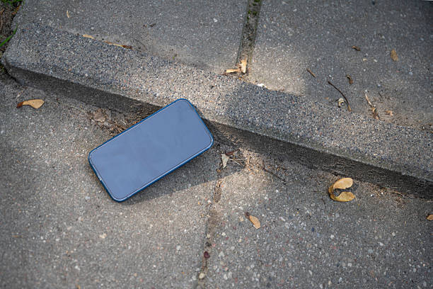 istock Mobile phone lies on ground. 2232762654