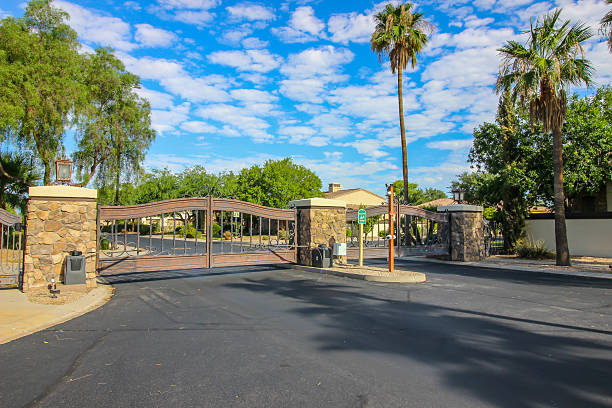 istock Entrance And Exit Gates To Secure Housing Subdivision 2232763529