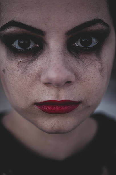 istock Dramatic female portrait with tears and red lipstick. 2232768657