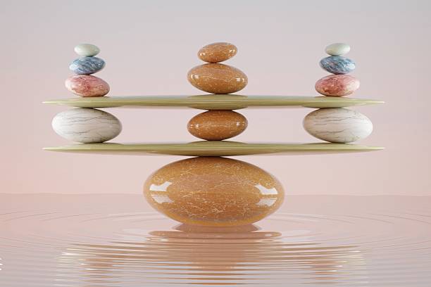 istock stone stacking marble stone sculpture, on rippled water 2232769114