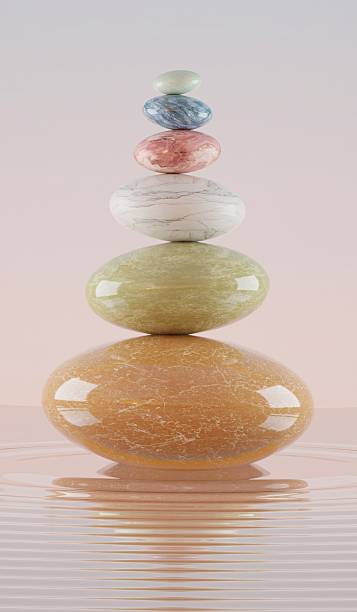 istock stone stacking marble stone sculpture, on rippled water 2232769120