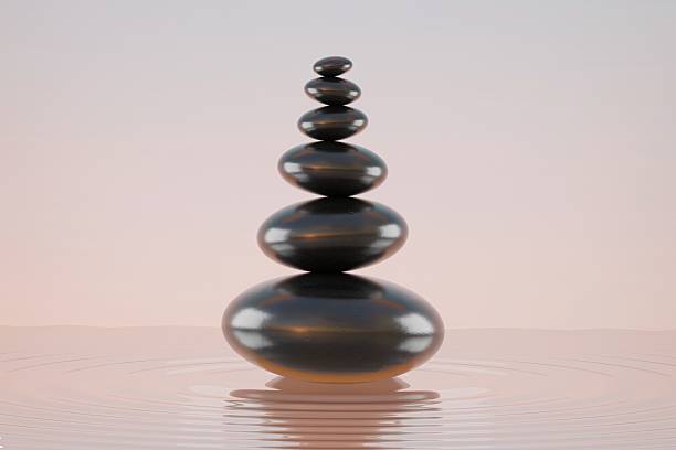 istock stone stacking marble stone sculpture, on rippled water 2232769123